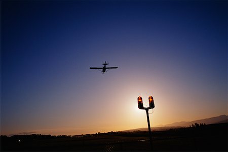 simsearch:700-00026618,k - Plane Landing at Dusk Stock Photo - Rights-Managed, Code: 700-00088387