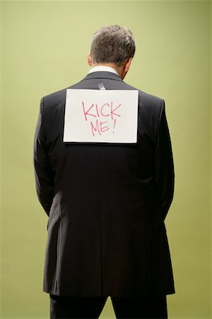 Man with Sign on Back Stock Photo - Rights-Managed, Code: 700-00088607