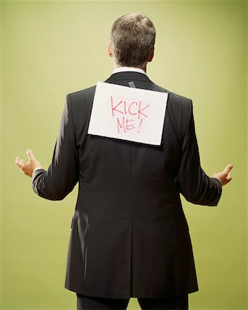 Man with Sign on Back Stock Photo - Rights-Managed, Code: 700-00088608