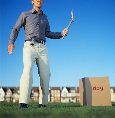 dog man bizarre - Man Throwing Stick to Box Stock Photo - Rights-Managed, Code: 700-00088618