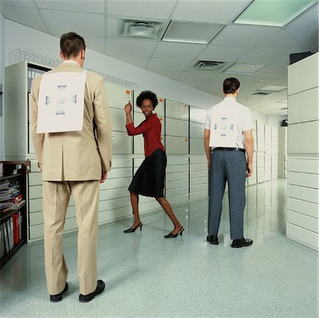 Businesswoman and Businessmen in Office with Targets Stock Photo - Rights-Managed, Code: 700-00088906