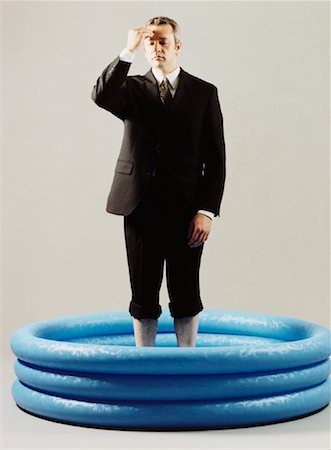 Businessman in Kid's Pool Stock Photo - Rights-Managed, Code: 700-00089107