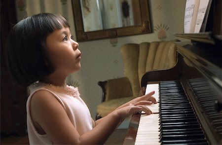 sad girl playing piano