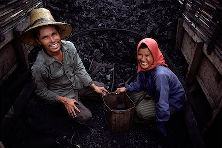 simsearch:700-00080150,k - Portrait of Couple Selling Charcoal on Boat Bangkok, Thailand Stock Photo - Rights-Managed, Code: 700-00080042