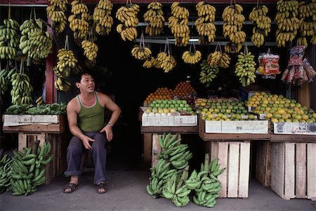 perak - Homme assis dans la boutique de fruits Teluk Intan, Perak, Malaisie Photographie de stock - Rights-Managed, Code: 700-00080145