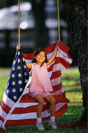 Portrait of Girl on Swing With American Flag Stock Photo - Rights-Managed, Code: 700-00080252