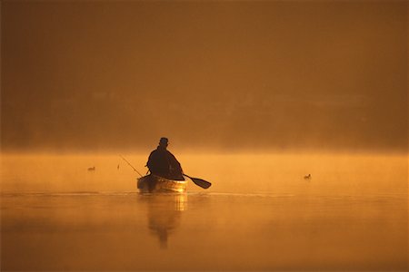 simsearch:700-00086986,k - Back View of Mature Man Fishing From Canoe at Sunrise Stock Photo - Rights-Managed, Code: 700-00080546