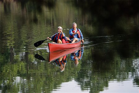 Mature Couple Canoeing Stock Photo - Rights-Managed, Code: 700-00080553