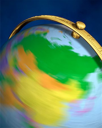 Blurred View of Globe Spinning On Stand Asia Stock Photo - Rights-Managed, Code: 700-00080720