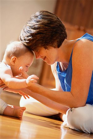 simsearch:700-00074987,k - Mother and Baby Sitting on Floor Face to Face Stock Photo - Rights-Managed, Code: 700-00081000