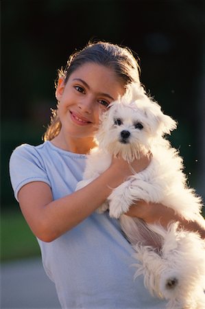 simsearch:700-00098404,k - Portrait of Girl Holding Dog Outdoors Fotografie stock - Rights-Managed, Codice: 700-00081011