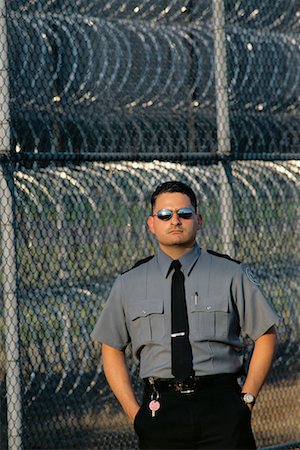 prison guards in uniform - Portrait of Male Prison Guard Outdoors, Michigan State Penitentiary, Michigan, USA Foto de stock - Con derechos protegidos, Código: 700-00081107
