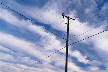 simsearch:700-02080360,k - Telephone Pole and Clouds in Sky Stock Photo - Rights-Managed, Code: 700-00081130