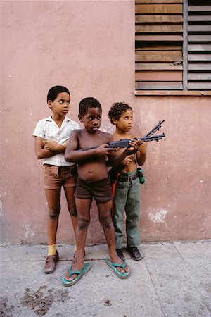 david mendelsohn child - Portrait of Children Playing with Toy Guns Outdoors Havana, Cuba Stock Photo - Rights-Managed, Code: 700-00081215