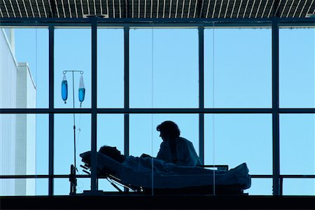 saskatchewan people working - Doctor with Patient in Hospital Bed Saskatoon, Saskatchewan, Canada Stock Photo - Rights-Managed, Code: 700-00081276