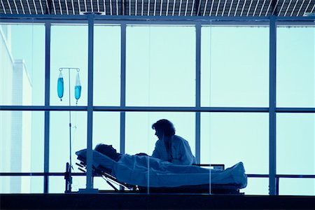 saskatchewan people working - Doctor with Patient in Hospital Bed Saskatoon, Saskatchewan, Canada Stock Photo - Rights-Managed, Code: 700-00081277