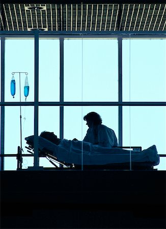 saskatchewan people working - Doctor with Patient in Hospital Bed Saskatoon, Saskatchewan, Canada Stock Photo - Rights-Managed, Code: 700-00081280