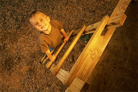 Portrait of Boy Climbing Tree House Ladder Stock Photo - Rights-Managed, Code: 700-00081382