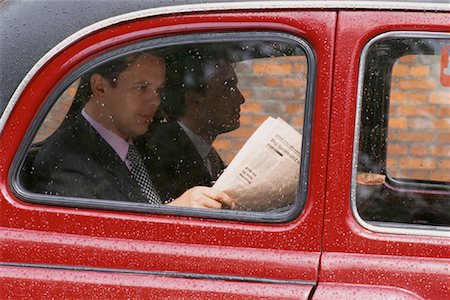 simsearch:700-00094724,k - Businessmen Reading Newspaper in Taxi Stock Photo - Rights-Managed, Code: 700-00081502