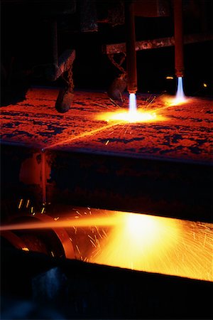 sparks of molten metal - Slab of Molten Steel Being Cut Stock Photo - Rights-Managed, Code: 700-00081549