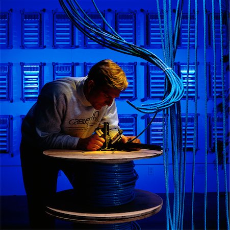 Man Installing Wiring for Computer Network Stock Photo - Rights-Managed, Code: 700-00081562