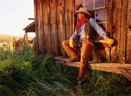 simsearch:700-00016165,k - Cowboy Leaning on Wall at Douglas Lake Ranch, British Columbia Canada Stock Photo - Rights-Managed, Code: 700-00081771