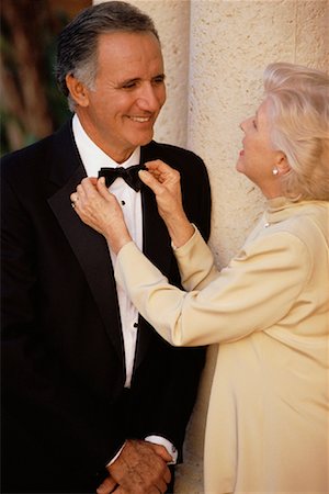 straighten - Mature Couple in Formal Wear, Woman Adjusting Man's Tie Stock Photo - Rights-Managed, Code: 700-00081891