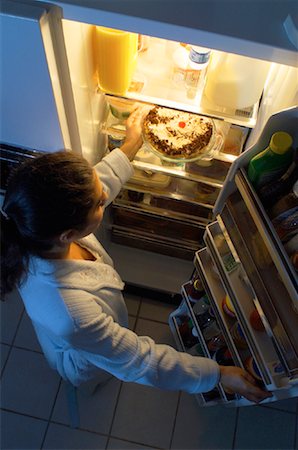 Woman Standing at Fridge, Having Pie as Midnight Snack Stock Photo - Rights-Managed, Code: 700-00082295