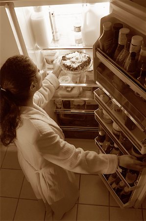 Woman Standing at Fridge, Having Pie as Midnight Snack Stock Photo - Rights-Managed, Code: 700-00082297