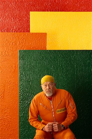 divisa da carcerato - Portrait of Man in Prison Clothes Fotografie stock - Rights-Managed, Codice: 700-00082897