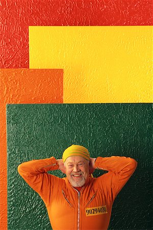 divisa da carcerato - Portrait of Man in Prison Clothes Smiling Fotografie stock - Rights-Managed, Codice: 700-00082898