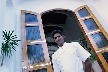 Portrait of Chef in Doorway at Saint Geran Resort Island of Mauritius, Indian Ocean Stock Photo - Rights-Managed, Code: 700-00082911