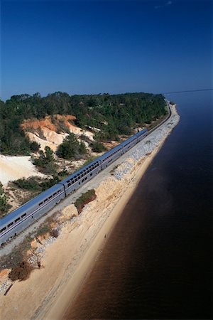 simsearch:700-00082931,k - Passenger Train by Shoreline and Trees Near Pensacola, Florida, USA Stock Photo - Rights-Managed, Code: 700-00082926