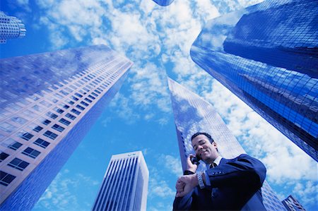 simsearch:700-00027893,k - Businessman Using Cell Phone Checking Watch by Office Towers Los Angeles, California, USA Foto de stock - Con derechos protegidos, Código: 700-00083387