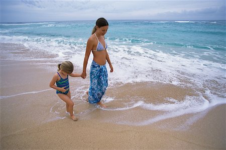 peter griffith - Mother and Daughter in Swimwear Walking on Beach Holding Hands Stock Photo - Rights-Managed, Code: 700-00083486