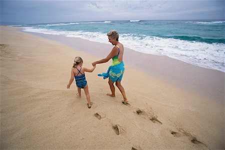 peter griffith - Grandmother and Granddaughter Walking on Beach, Holding Hands Stock Photo - Rights-Managed, Code: 700-00083491