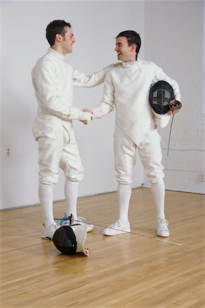 Two Men in Fencing Uniforms Shaking Hands Stock Photo - Rights-Managed, Code: 700-00083518