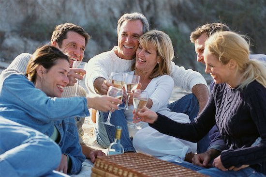 Couples Sitting on Beach Toasting with Glasses of Wine Stock Photo - Premium Rights-Managed, Artist: Kevin Dodge, Image code: 700-00083578