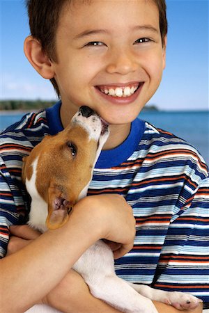 simsearch:700-03644589,k - Portrait of Boy with Dog Licking Face Foto de stock - Con derechos protegidos, Código: 700-00083941