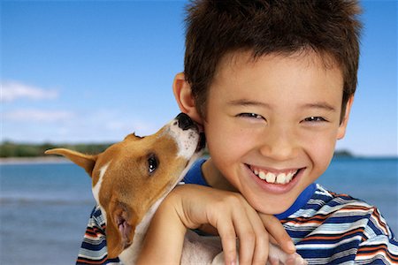 simsearch:700-03644589,k - Portrait of Boy with Dog Licking Ear Foto de stock - Con derechos protegidos, Código: 700-00083942
