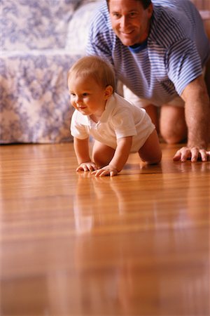 dad crawling - Parent Crawling Behind Child Stock Photo - Rights-Managed, Code: 700-00094086
