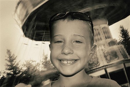 swing chair ride - Portrait of Boy at Amusement Park Stock Photo - Rights-Managed, Code: 700-00094914