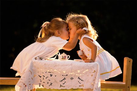 family tea time - Young Girls Kissing Stock Photo - Rights-Managed, Code: 700-00094942