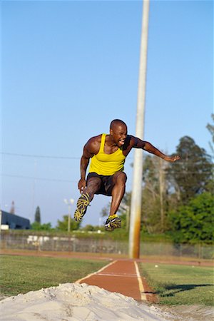 salto in lungo - Running Long Jump Fotografie stock - Rights-Managed, Codice: 700-00095533