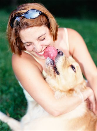 dogs licking women - Dog Licking Woman's Face Stock Photo - Rights-Managed, Code: 700-00095769