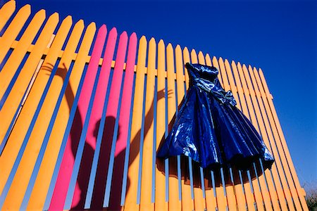 Blue Gown on Colorful Fence Stock Photo - Rights-Managed, Code: 700-00095793