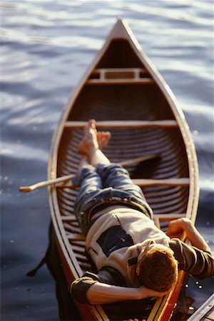 Personne couchée en canot flottant Photographie de stock - Rights-Managed, Code: 700-00096140