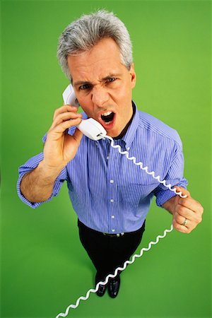 simsearch:6108-05868462,k - Humorous Portrait of Man Talking on Telephone Stock Photo - Rights-Managed, Code: 700-00096676