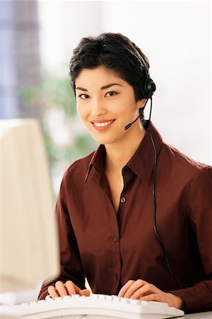 Businesswoman Wearing Headset Foto de stock - Con derechos protegidos, Código: 700-00096680