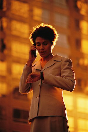 simsearch:700-00071171,k - Woman Talking on Cell Phone and Checking the Time Stock Photo - Rights-Managed, Code: 700-00096865